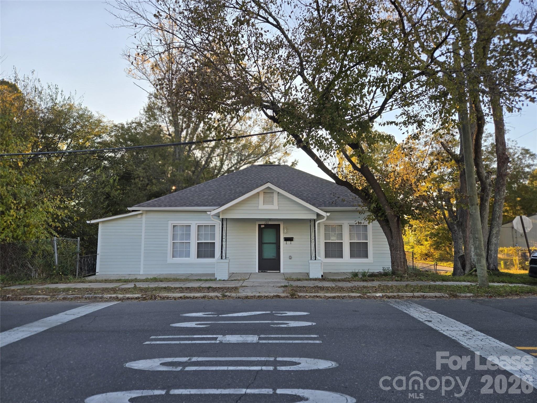 101 South Webb Street Gastonia, NC 28052 - Photo 11 of 40 a front view of a house with a garden