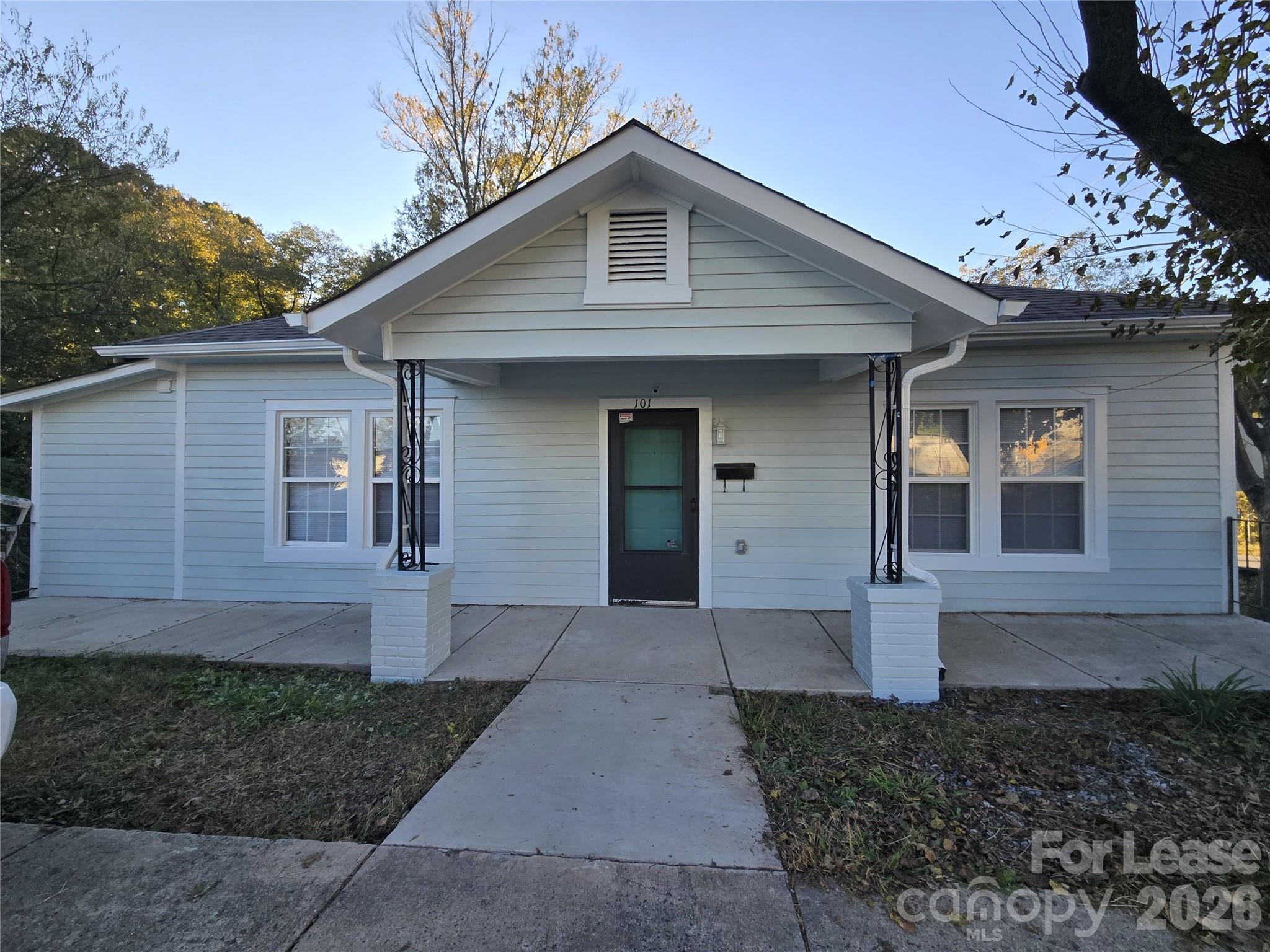 101 South Webb Street Gastonia, NC 28052 - Photo 12 of 40 a front view of a house with a yard and garage