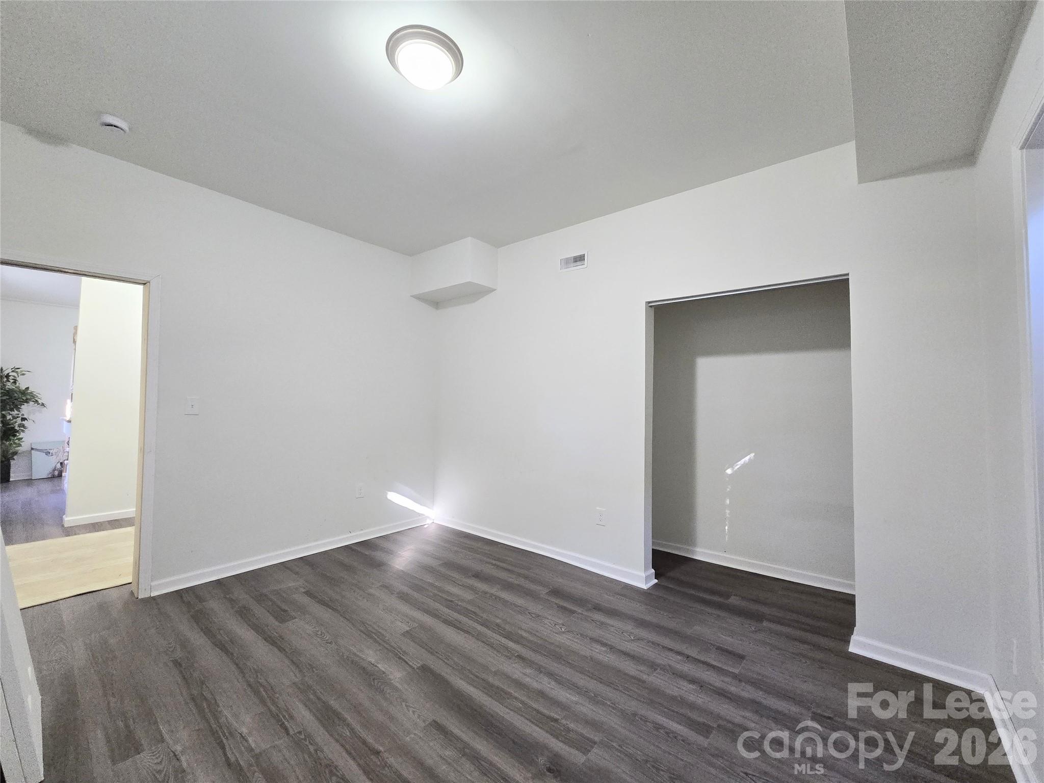 101 South Webb Street Gastonia, NC 28052 - Photo 14 of 40 a view of an empty room with wooden floor