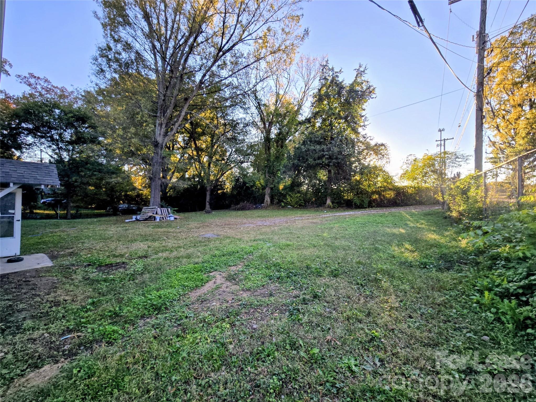 101 South Webb Street Gastonia, NC 28052 - Photo 21 of 40 a view of a grassy field with trees