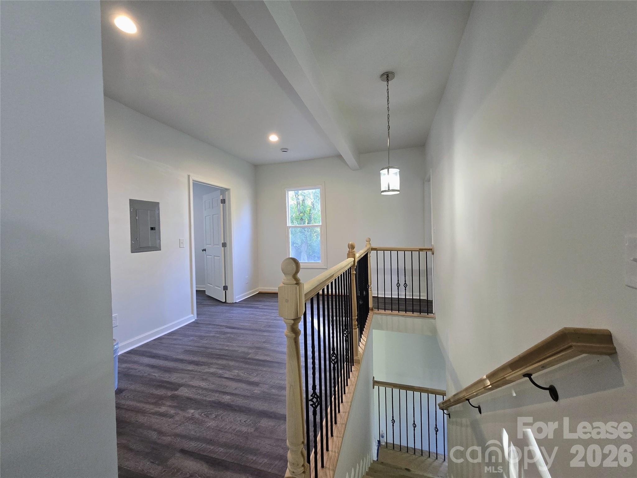 101 South Webb Street Gastonia, NC 28052 - Photo 25 of 40 a view of a hallway with wooden floor and windows