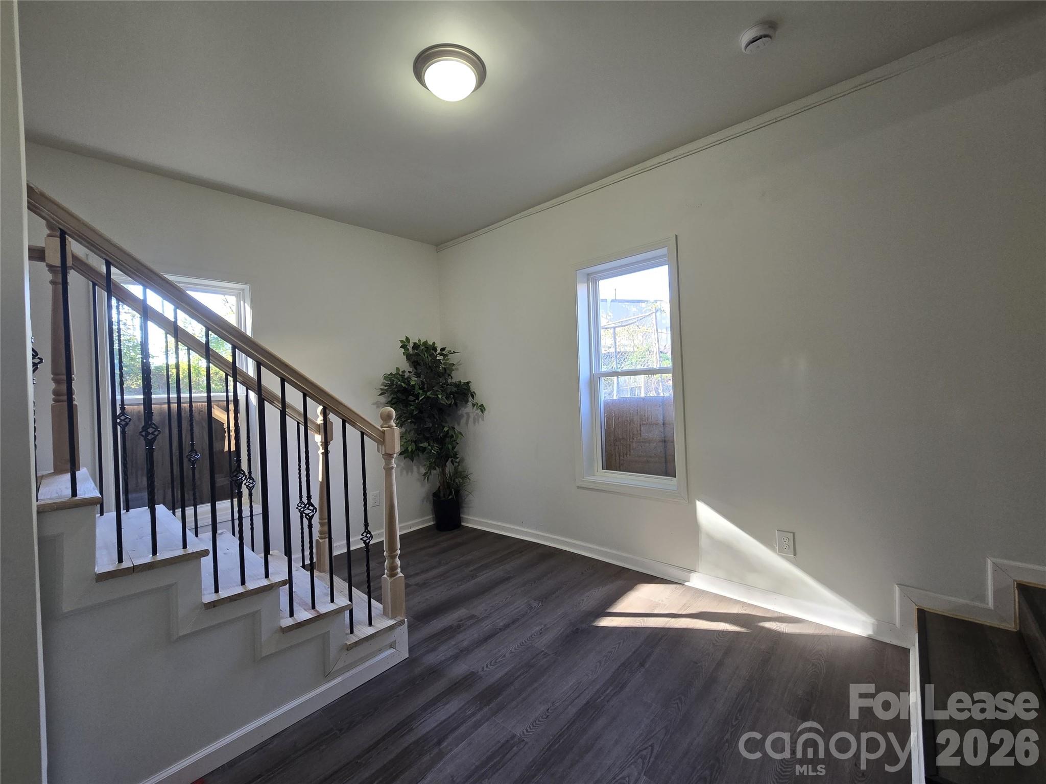 101 South Webb Street Gastonia, NC 28052 - Photo 28 of 40 a view of entryway and hall with wooden floor