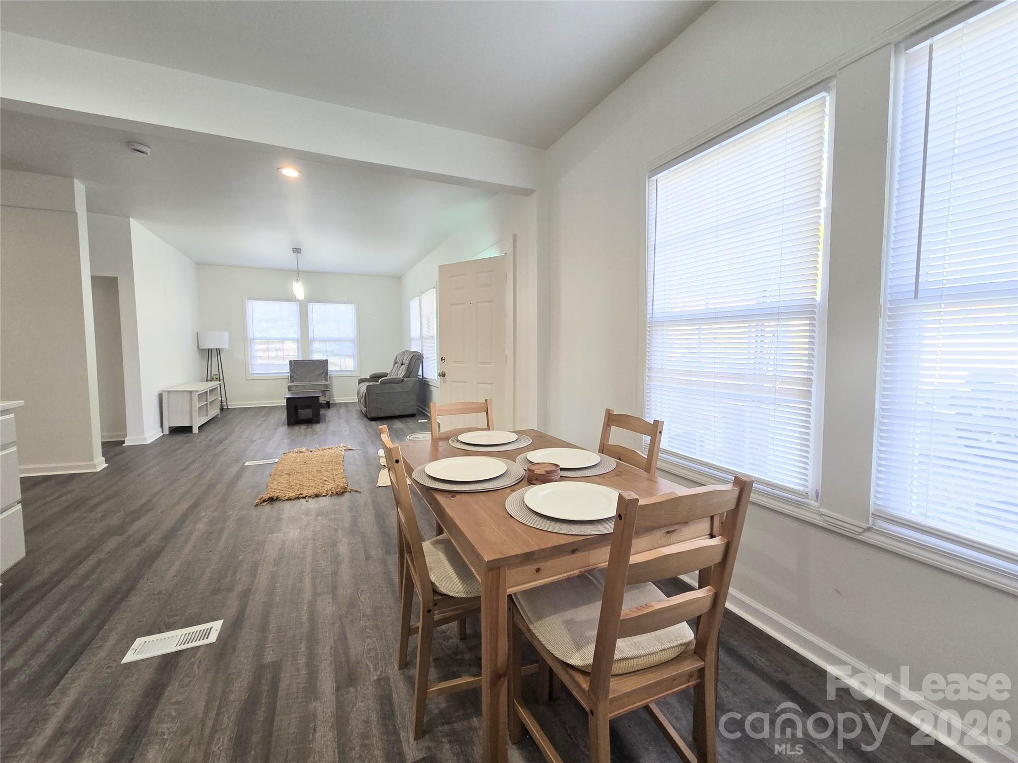 101 South Webb Street Gastonia, NC 28052 - Photo 3 of 40 a dining room with furniture and wooden floor