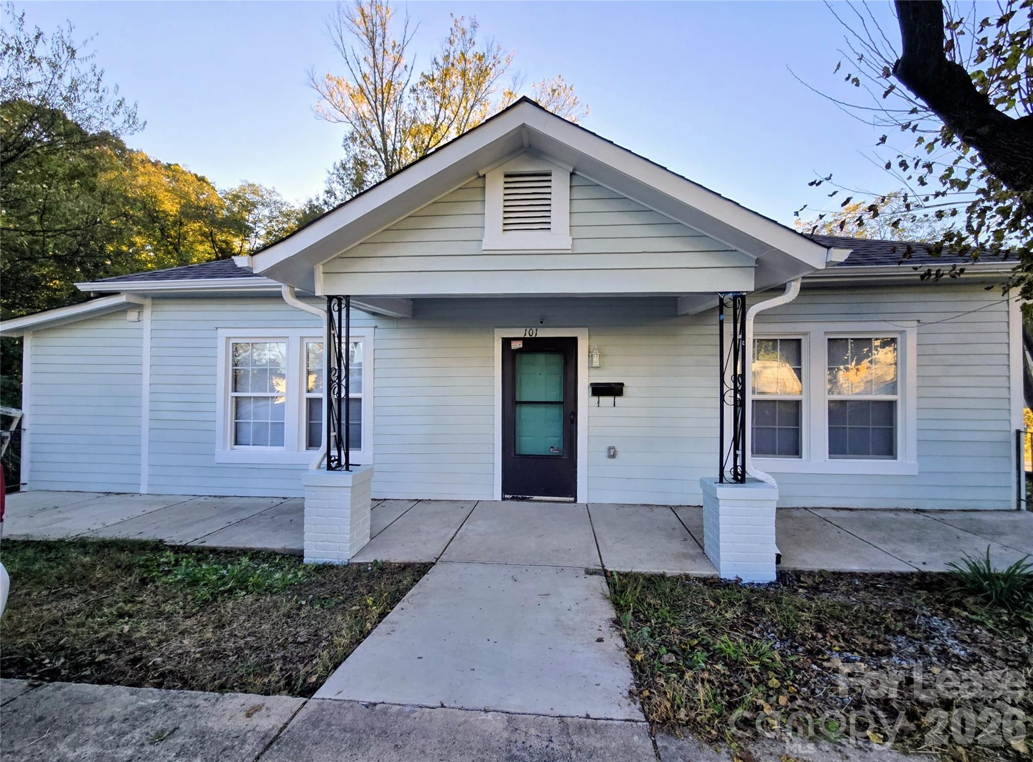 101 South Webb Street Gastonia, NC 28052 - Photo 34 of 40 a front view of a house with a yard and garage