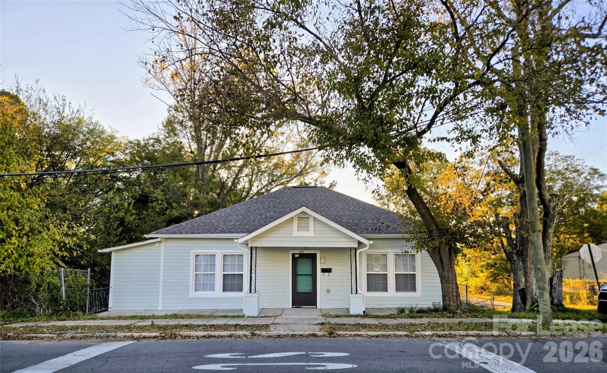 101 South Webb Street Gastonia, NC 28052 - Photo 39 of 40 a front view of a house with a garden