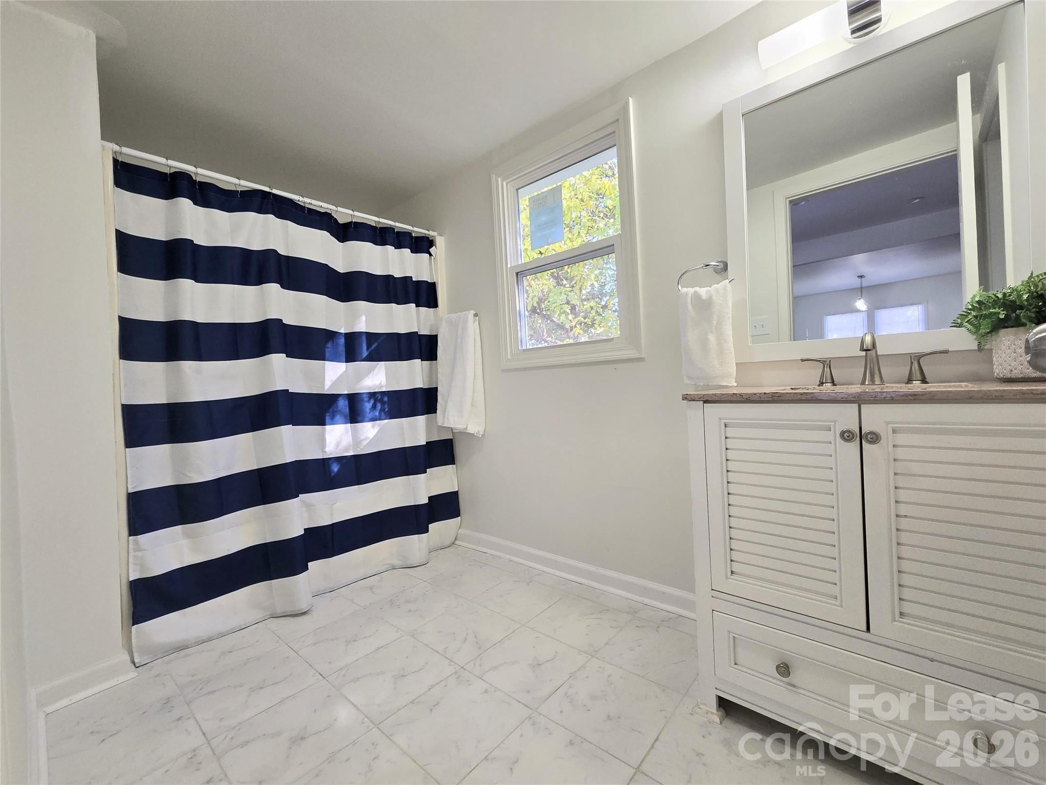 101 South Webb Street Gastonia, NC 28052 - Photo 6 of 40 a view of a bedroom with a window
