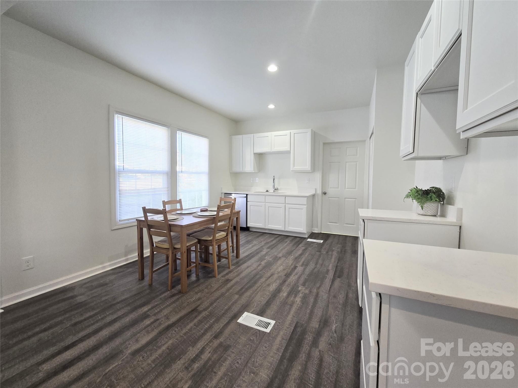 101 South Webb Street Gastonia, NC 28052 - Photo 8 of 40 a living room with furniture and a wooden floor