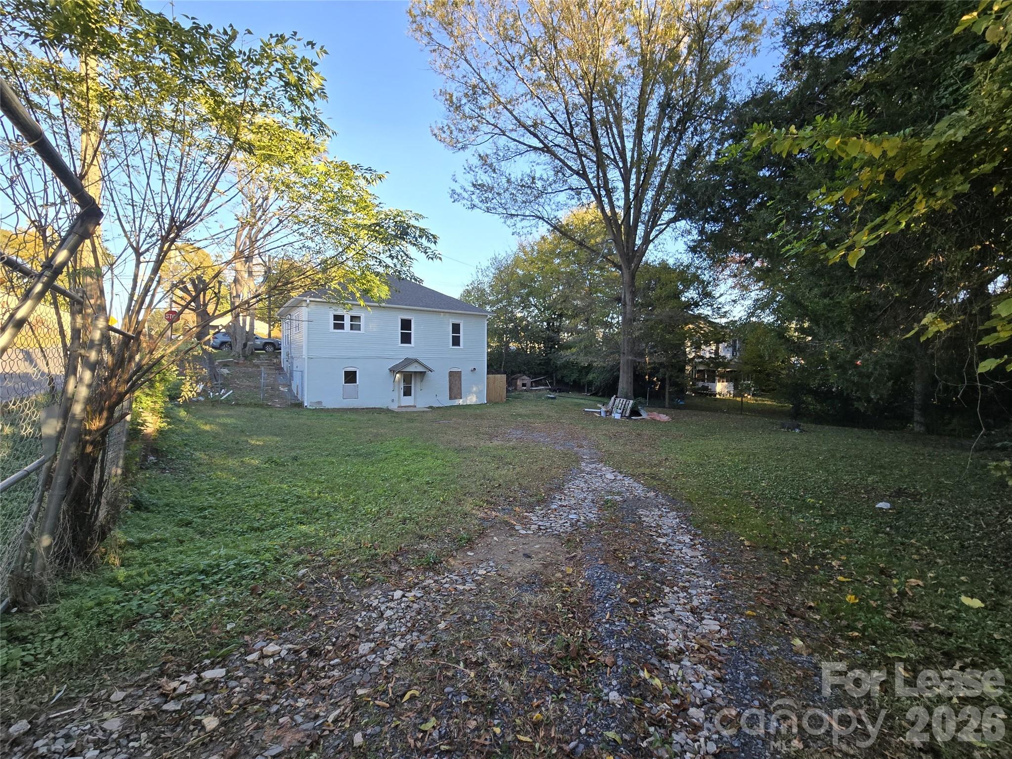 101 South Webb Street Gastonia, NC 28052 - Photo 10 of 40 a view of a house with yard and tree s
