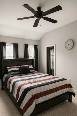 a bedroom with bed and window