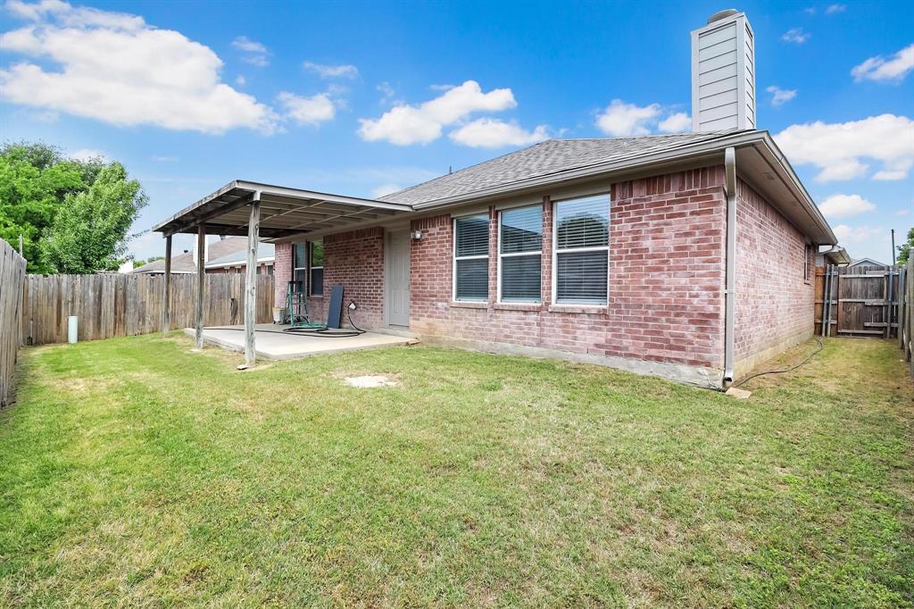 5528 Ridge View Drive Watauga, TX 76137 - Photo 3 of 16 Private backyard, good grass, Covered Patio.. All brick back .. Back yard faces south..