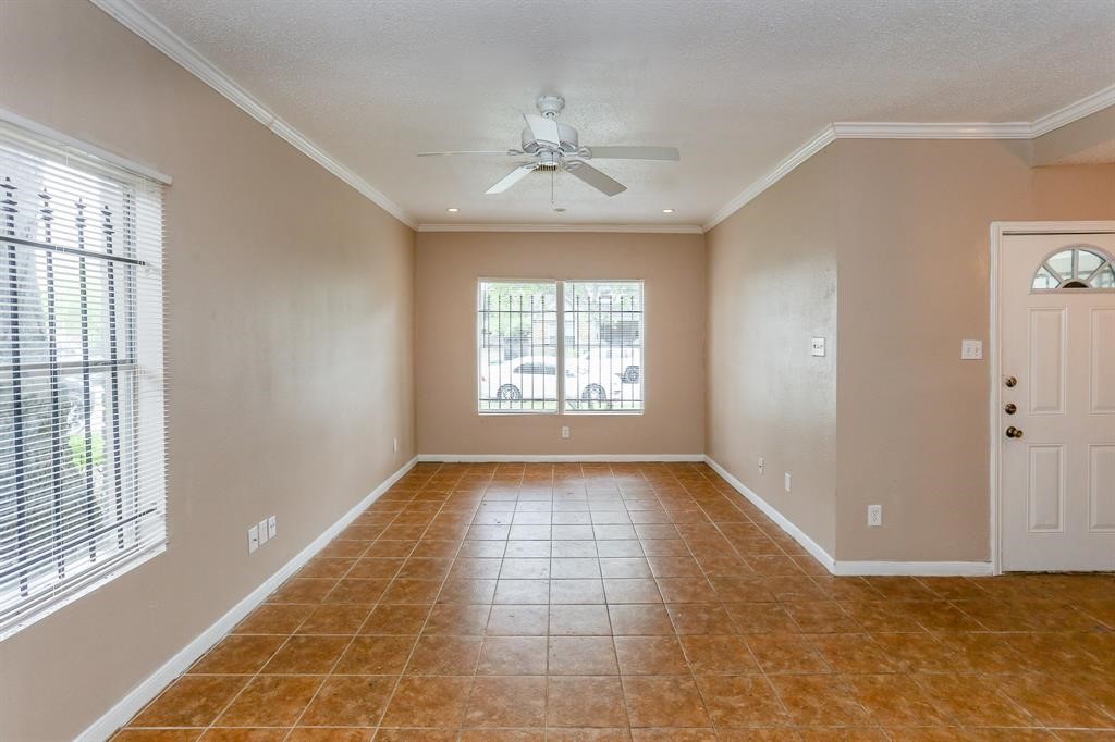 2612 Isabella Street Houston, TX 77004 - Photo 11 of 40 wooden floor in an empty room with a window