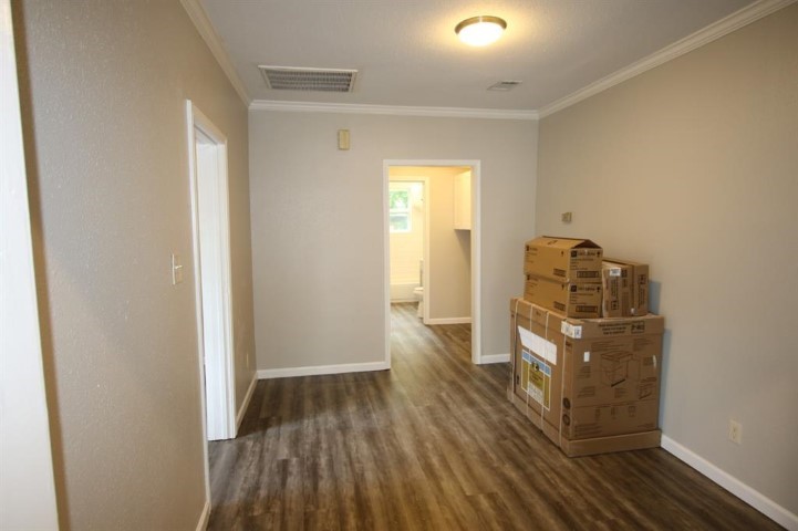 2612 Isabella Street Houston, TX 77004 - Photo 21 of 40 a room with wooden floor and closet