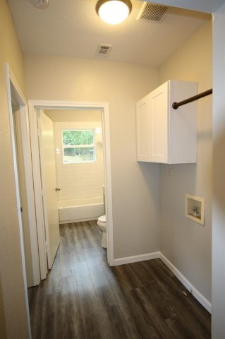 2612 Isabella Street Houston, TX 77004 - Photo 23 of 40 a view of a room with wooden floor and a window