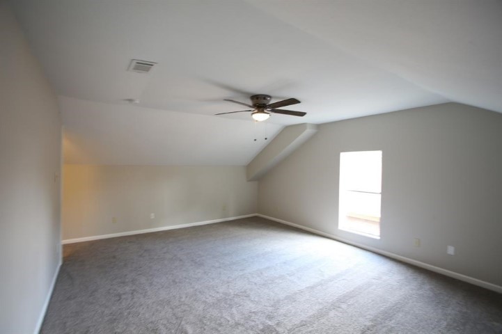 2612 Isabella Street Houston, TX 77004 - Photo 31 of 40 an empty room with a window and ceiling fan
