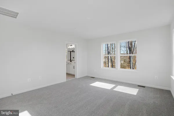 a bathroom with a sink vanity and mirror