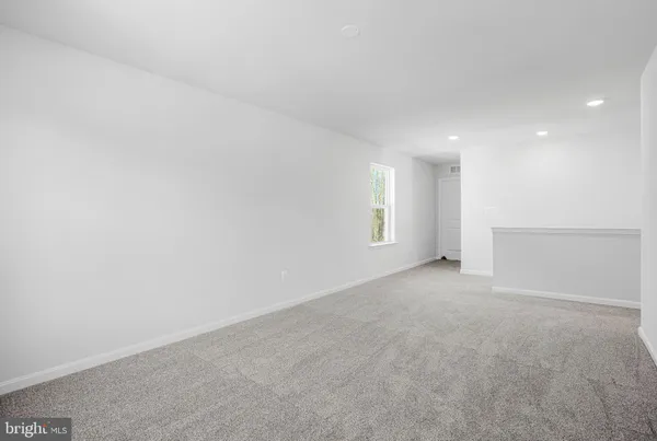 a view of a room with wooden floor and cabinet