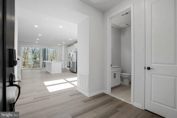 a view of kitchen with furniture and wooden floor