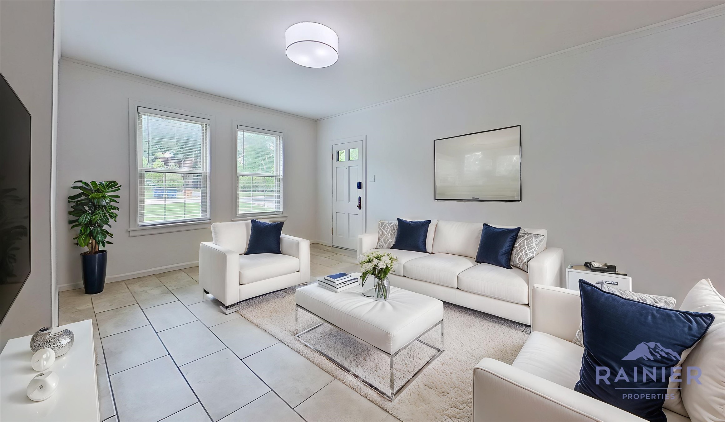 Virtually Staged: A well-lit living space, featuring ceramic tile floors and bright window light.