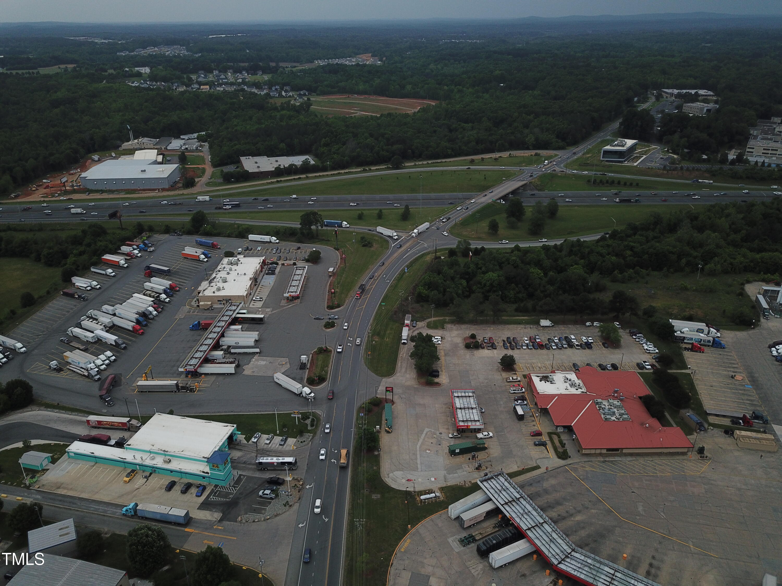 908 Jimmie Kerr Road Graham, NC 27258 - Photo 14 of 15 an aerial view of a house with a yard