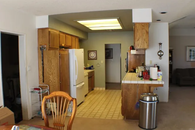 a kitchen with stainless steel appliances wooden cabinets and stove