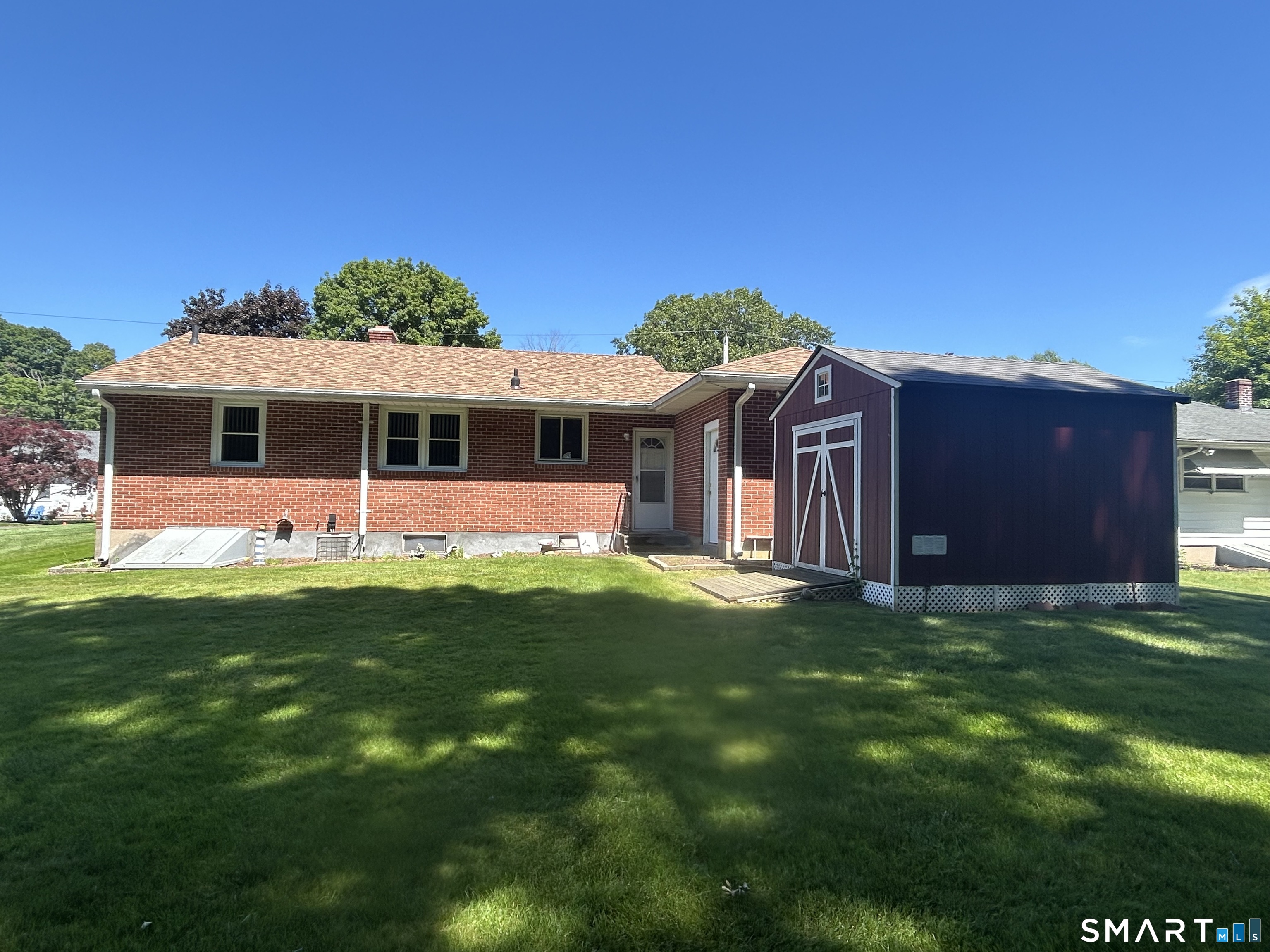 13 Walnut Lane Wallingford, CT 06492 - Photo 27 of 27 a view of a house with a backyard