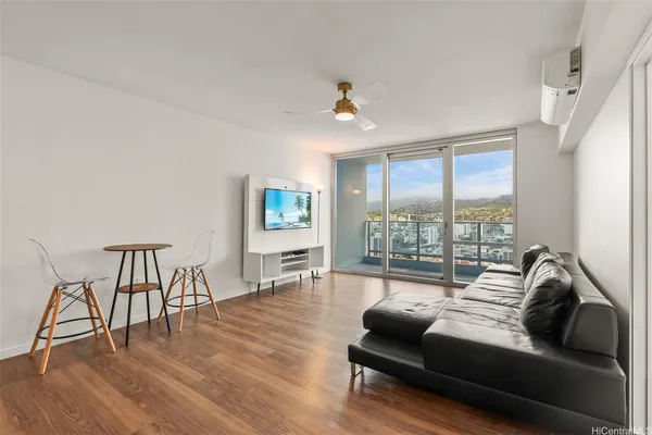 a living room with furniture and a large window