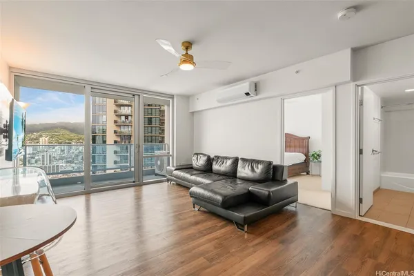 a living room with furniture and a large window