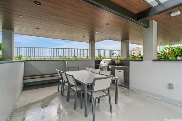 a view of a dining room with furniture and window