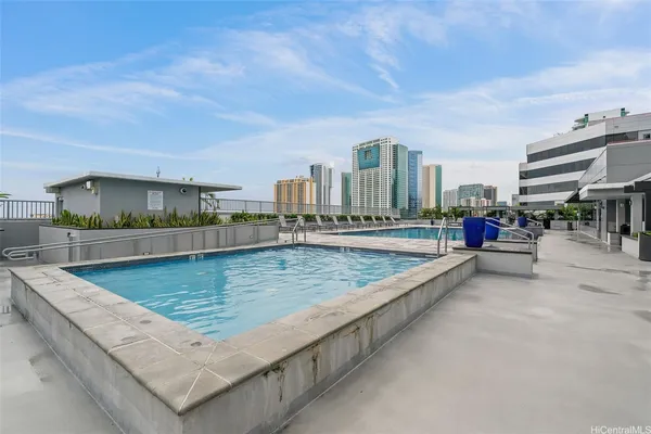 a view of swimming pool with chairs