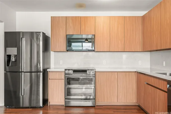 a kitchen with appliances and cabinets