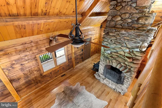 a large kitchen with stainless steel appliances kitchen island granite countertop a sink and cabinets