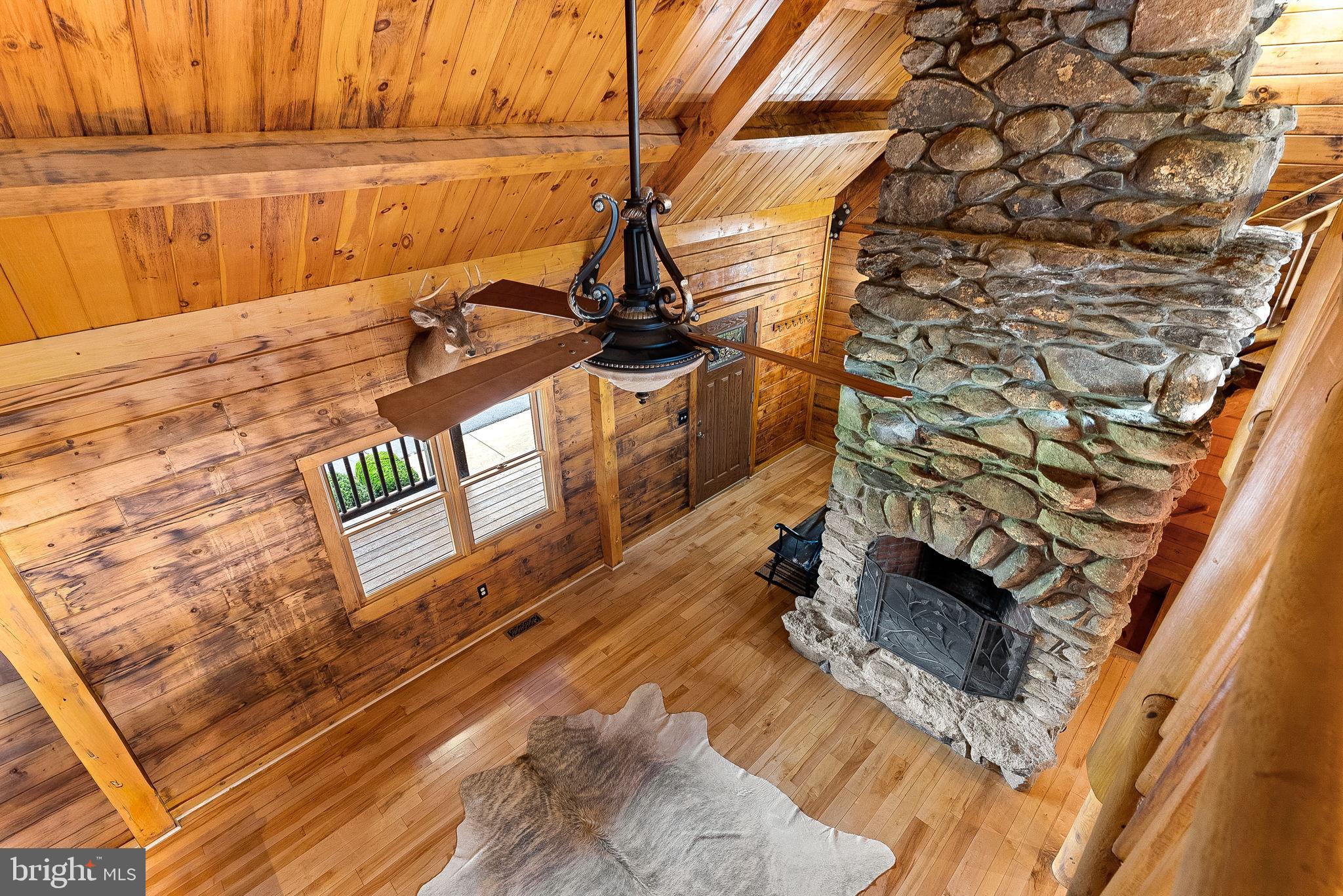 18837 Trinity Church Road Purcellville, VA 20132 - Photo 13 of 73 Rustic charm with a cozy stone fireplace.