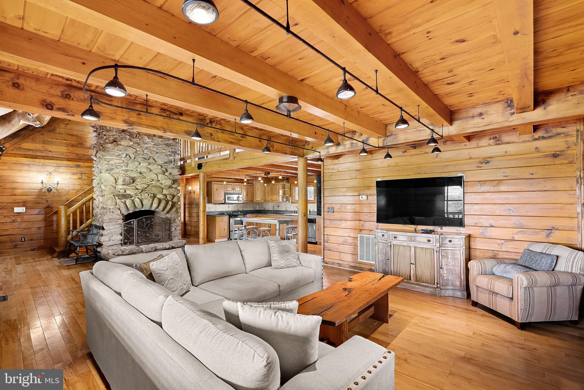 18837 Trinity Church Road Purcellville, VA 20132 - Photo 15 of 73 a living room with furniture and a flat screen tv