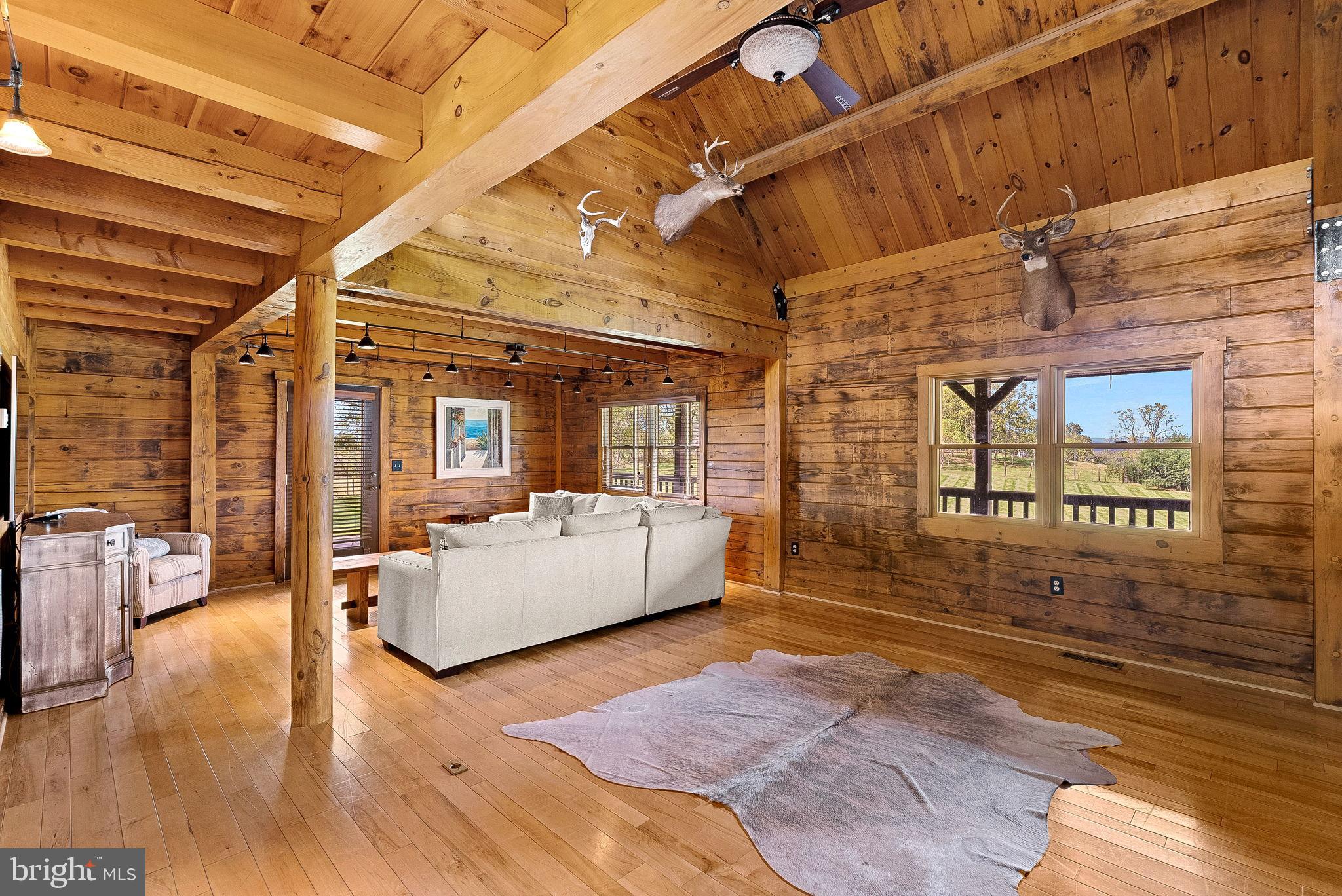 18837 Trinity Church Road Purcellville, VA 20132 - Photo 16 of 73 a view of living room with furniture and floor to ceiling window