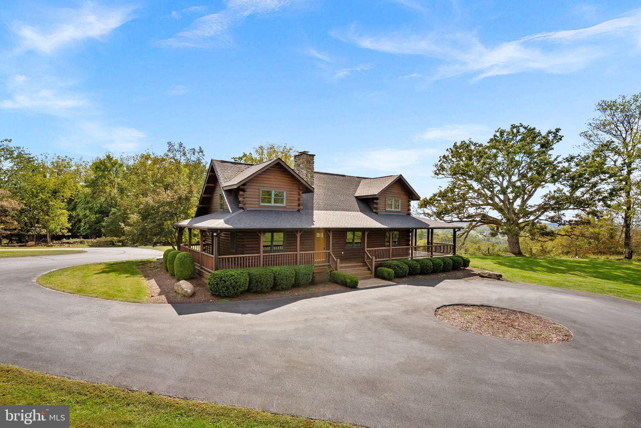 18837 Trinity Church Road Purcellville, VA 20132 - Photo 2 of 73 a view of a house with a big yard and large trees