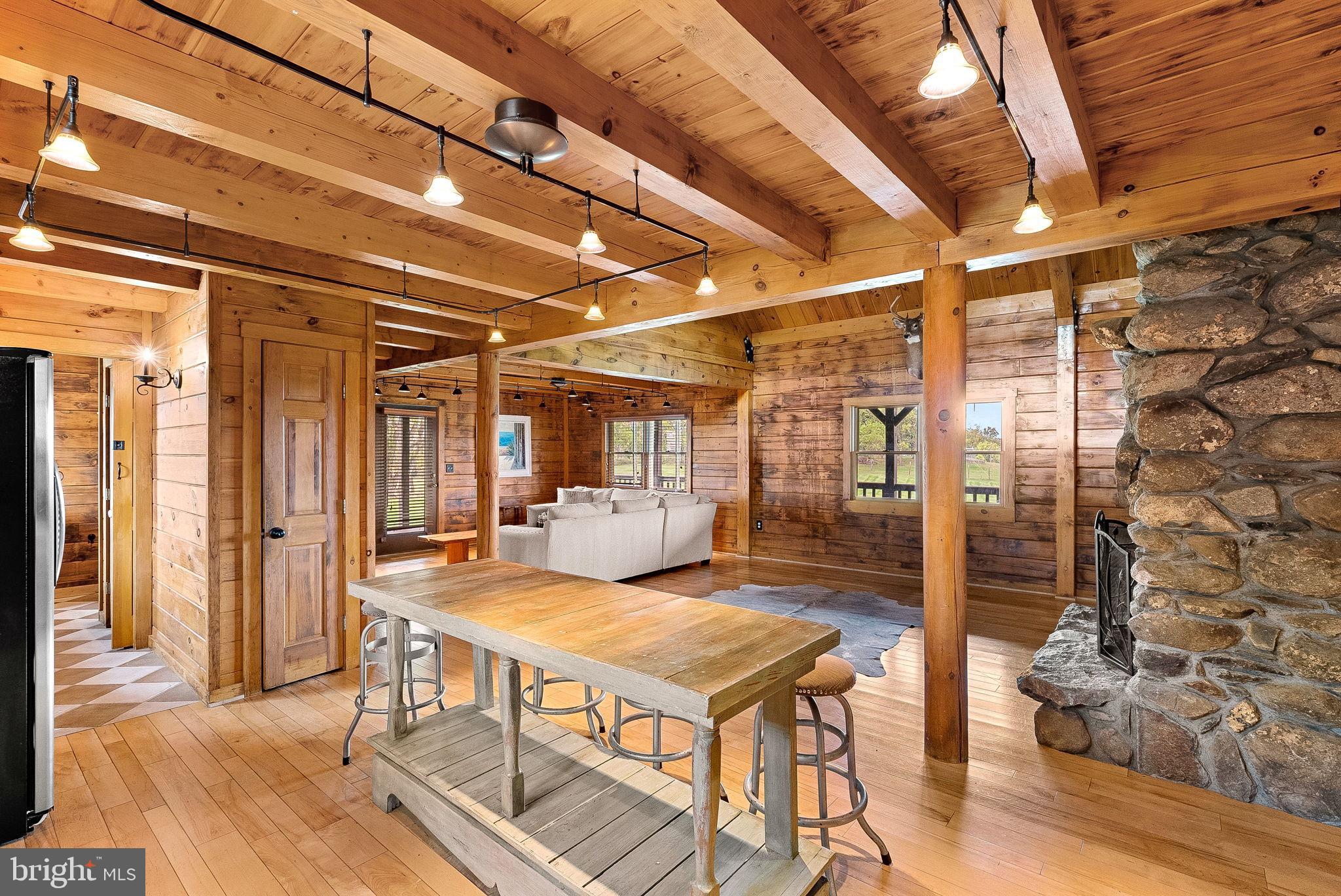 18837 Trinity Church Road Purcellville, VA 20132 - Photo 22 of 73 a view of a patio with table and chairs and potted plants