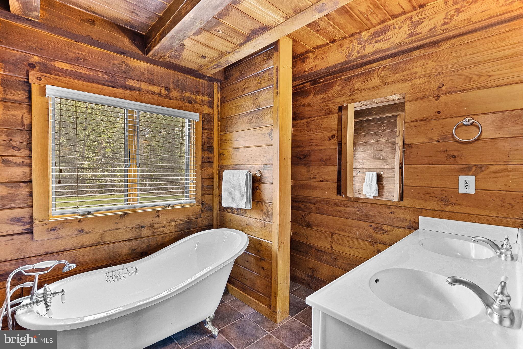 18837 Trinity Church Road Purcellville, VA 20132 - Photo 27 of 73 a bathroom with a sink and bathtub