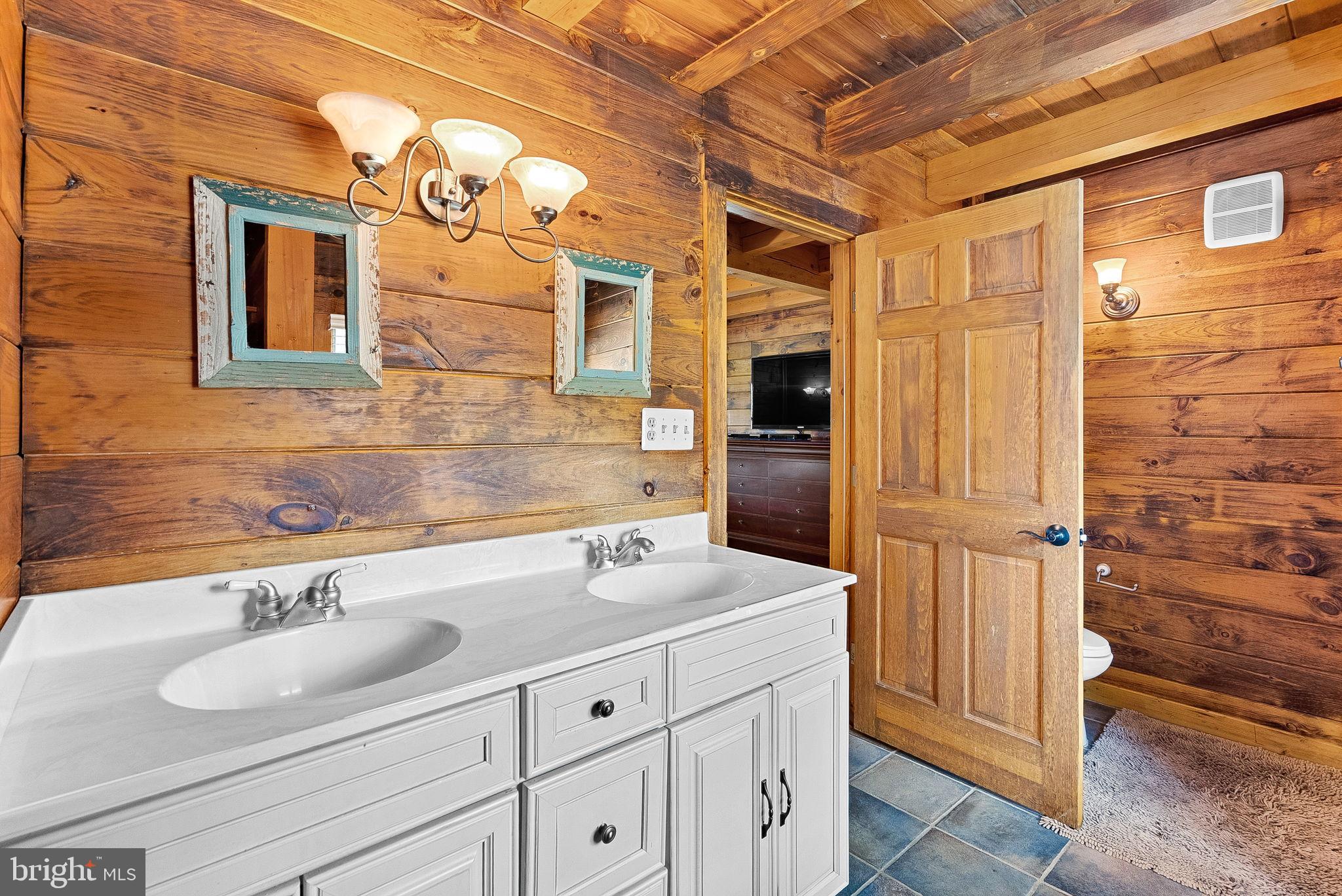 18837 Trinity Church Road Purcellville, VA 20132 - Photo 28 of 73 a bathroom with a sink and a mirror