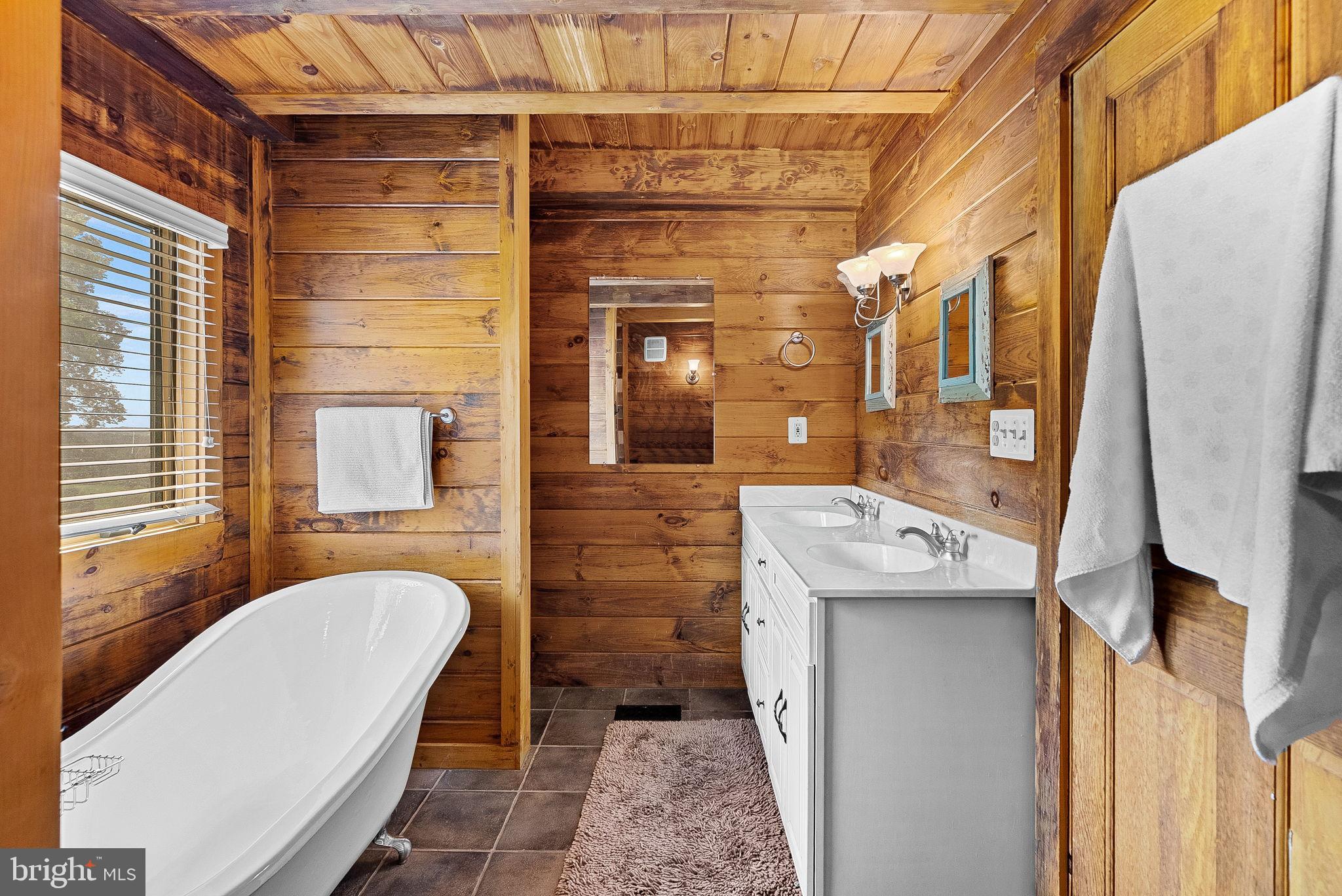 18837 Trinity Church Road Purcellville, VA 20132 - Photo 30 of 73 a bathroom with a sink a toilet and shower
