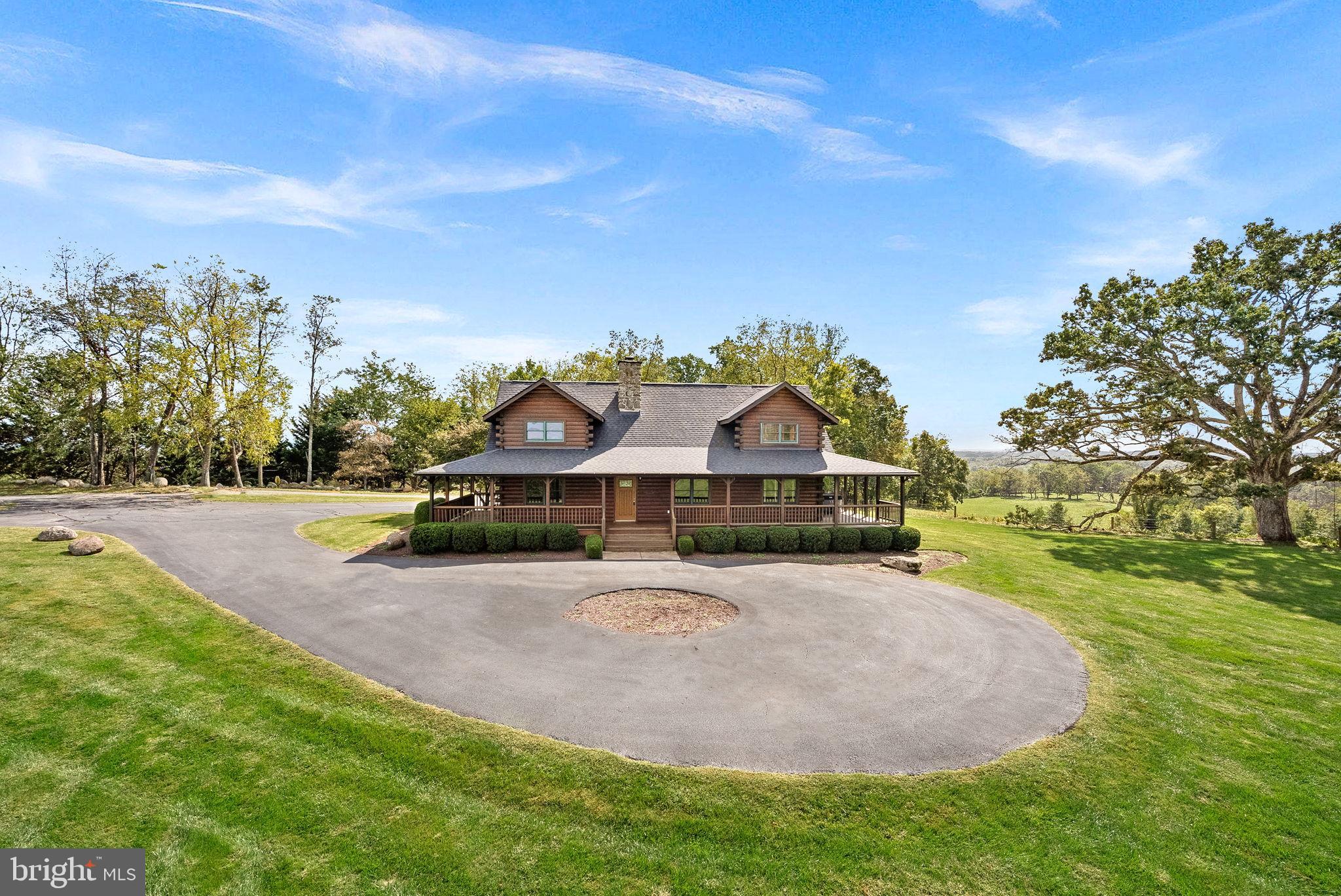 18837 Trinity Church Road Purcellville, VA 20132 - Photo 3 of 73 a front view of a house with a yard and trees