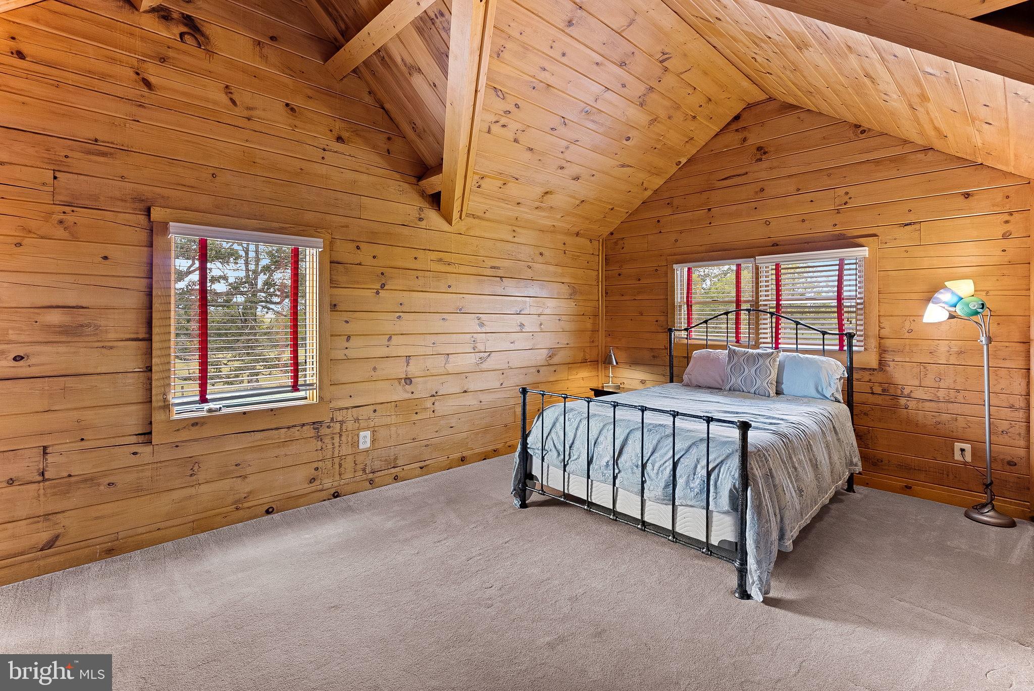 18837 Trinity Church Road Purcellville, VA 20132 - Photo 42 of 73 a spacious bedroom with a bed and window