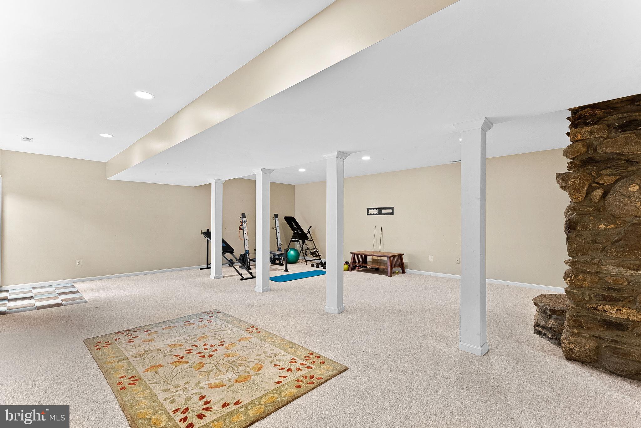18837 Trinity Church Road Purcellville, VA 20132 - Photo 46 of 73 a view of a hallway with a couch and chandelier