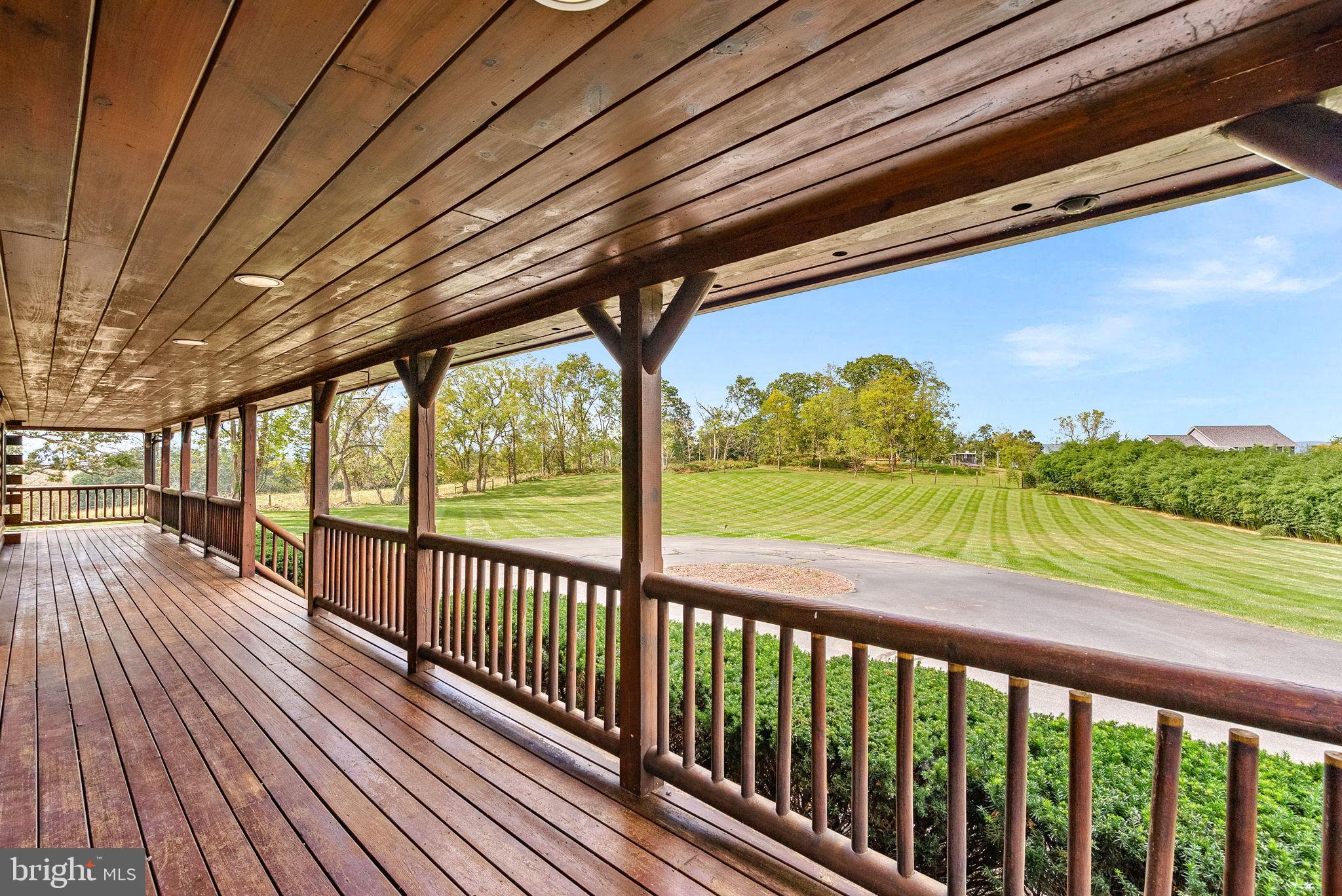 18837 Trinity Church Road Purcellville, VA 20132 - Photo 50 of 73 a view of a porch with wooden floor and outdoor space