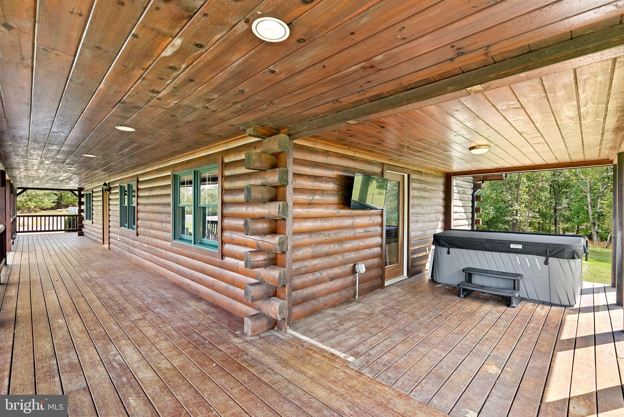 18837 Trinity Church Road Purcellville, VA 20132 - Photo 54 of 73 Spacious log cabin deck with serene views.