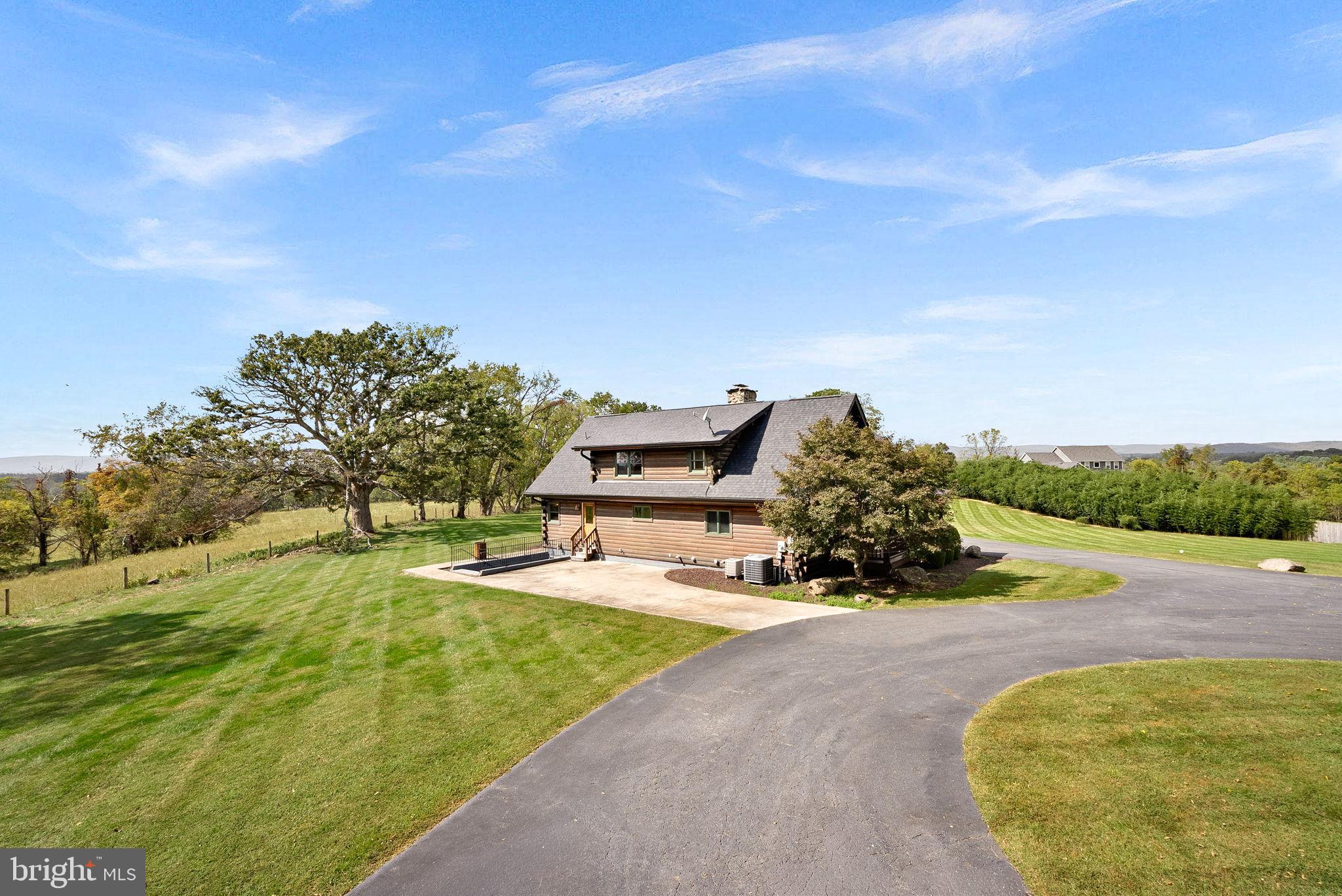 18837 Trinity Church Road Purcellville, VA 20132 - Photo 57 of 73 a view of a swimming pool with an outdoor seating and a garden