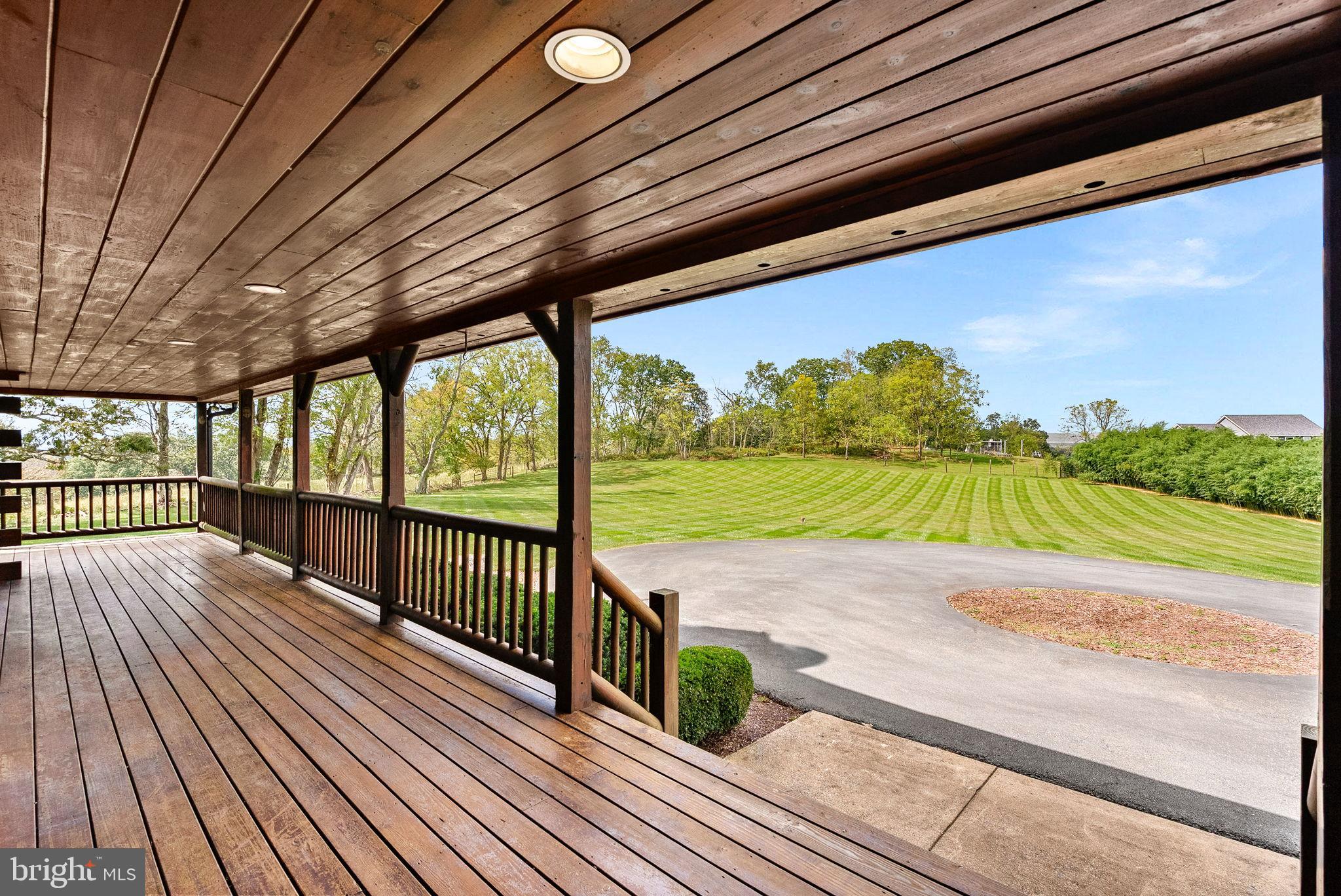 18837 Trinity Church Road Purcellville, VA 20132 - Photo 6 of 73 Spacious porch with scenic views ahead.