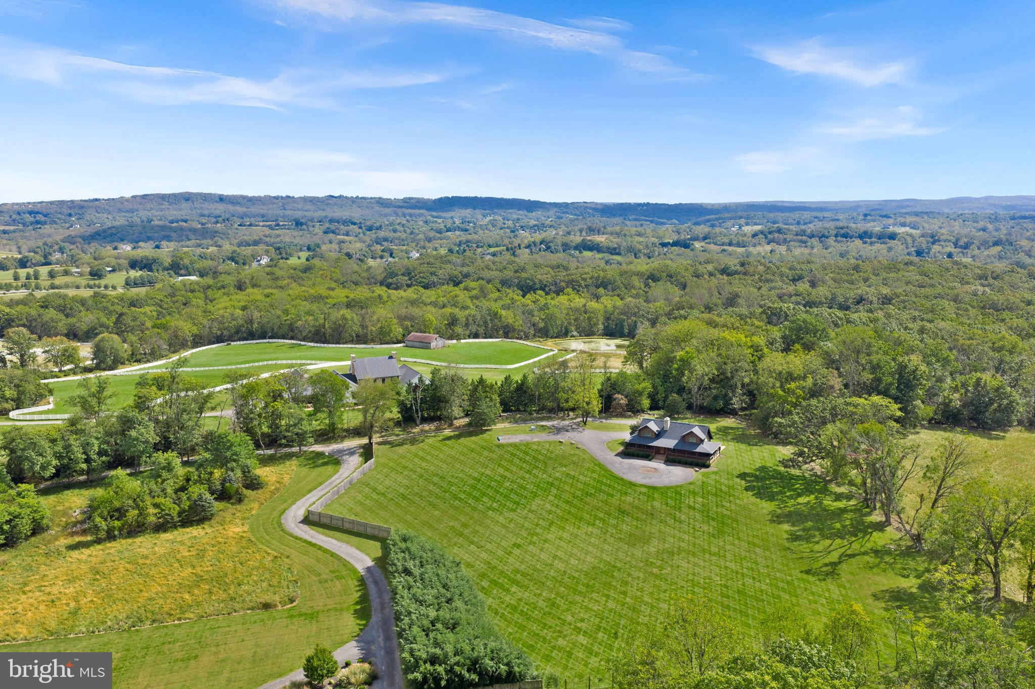 18837 Trinity Church Road Purcellville, VA 20132 - Photo 65 of 73 Expansive countryside retreat with lush greenery.