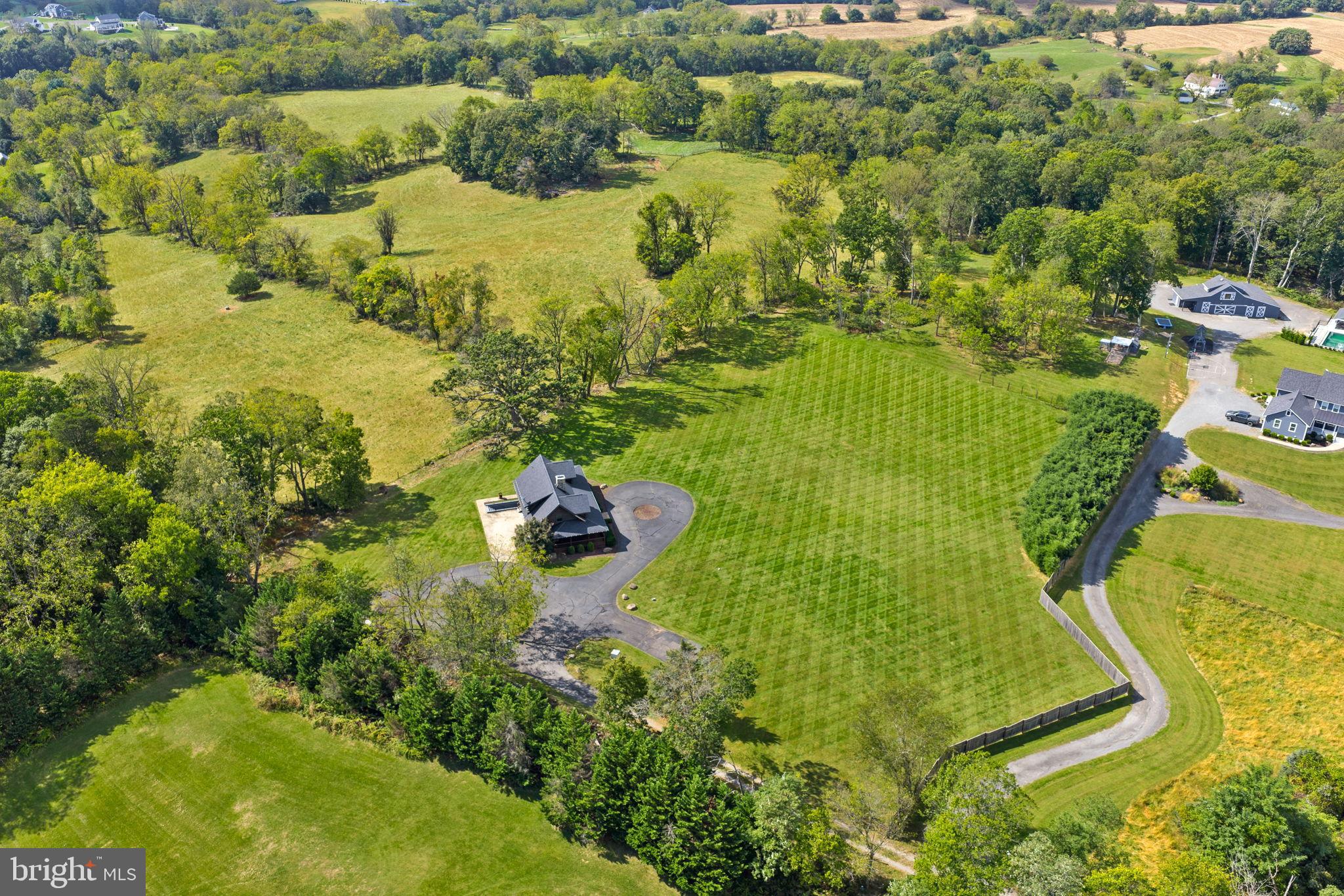 18837 Trinity Church Road Purcellville, VA 20132 - Photo 68 of 73 Sprawling countryside retreat with lush greenery.