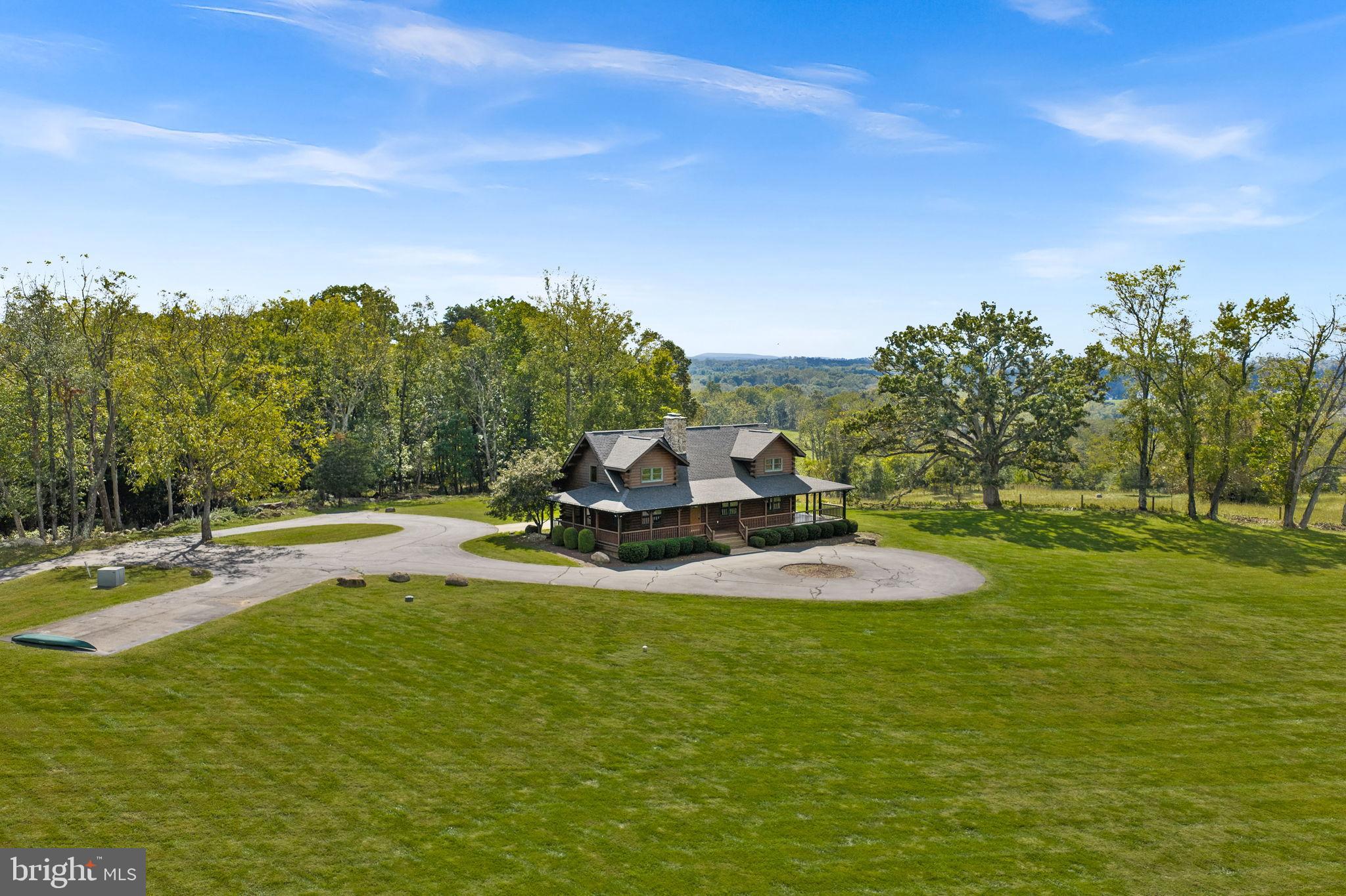 18837 Trinity Church Road Purcellville, VA 20132 - Photo 72 of 73 a view of a swimming pool with an outdoor space and seating area