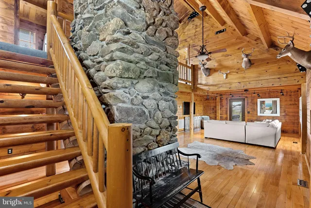 a view of living room with furniture and floor to ceiling window